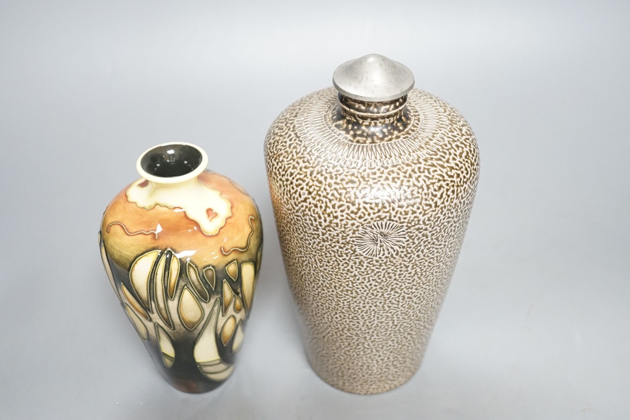 A Moorcroft vase, and a German stoneware flask, Moorcroft vase 16 cms high.